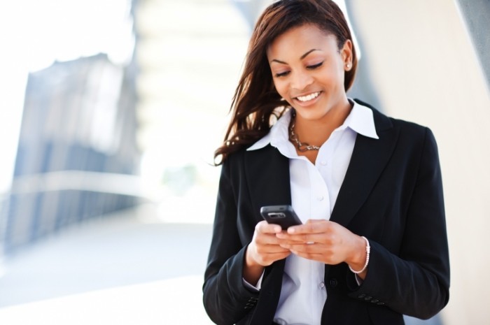 shutterstock 60909841 700x465 Бизнес леди с телефоном   Business woman with a phone