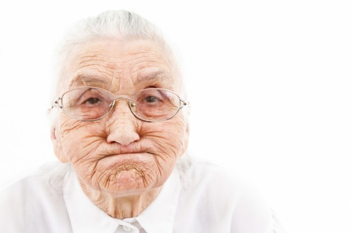 beautiful old woman with wrinkles making a face fotolia 511333233 700x465 Старушка   Old woman